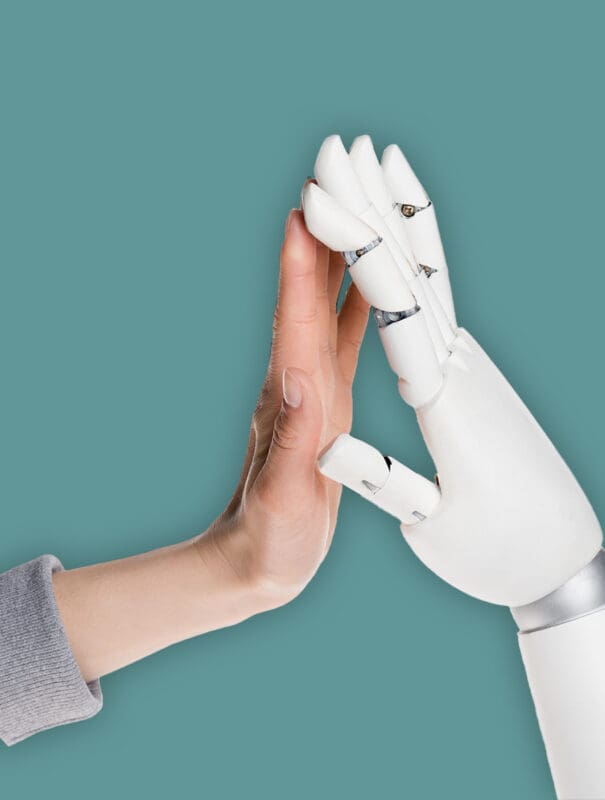 cropped shot of robot and human making high five isolated on white